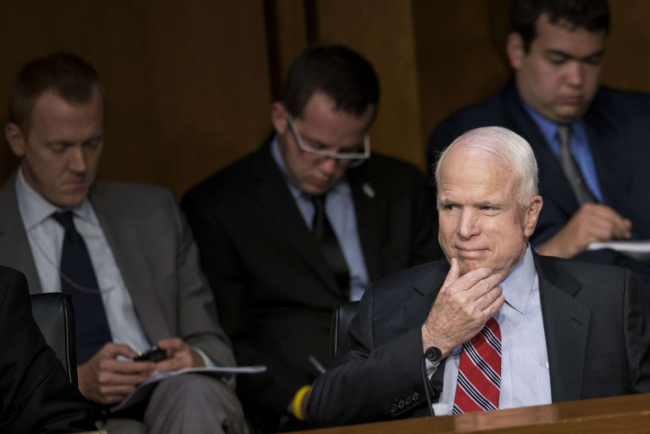 US senator John McCain caught playing poker on iPhone during key Syria air …