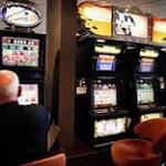 Australia gripped by poker machine addiction, report says